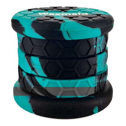 Cylindrical herb grinder with turquoise and black marbled pattern for smaller smoking accessories