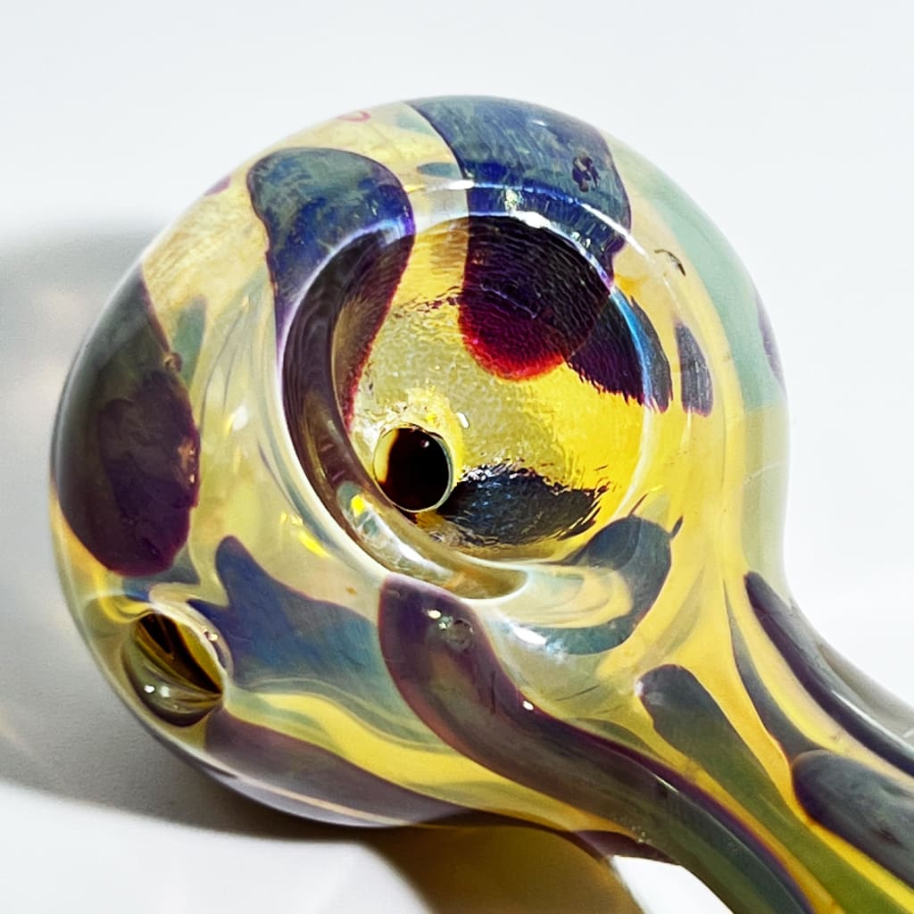 Vibrant 2.5-inch mini glass hand pipe with swirling yellow, blue, purple, red patterns