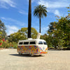 Colorfully decorated toy Volkswagen van with peace symbol, Groovy Trip Hippie Bus Hand Pipe