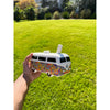 Colorful toy Volkswagen van with floral pattern Groovy Trip hippie bus hand pipe