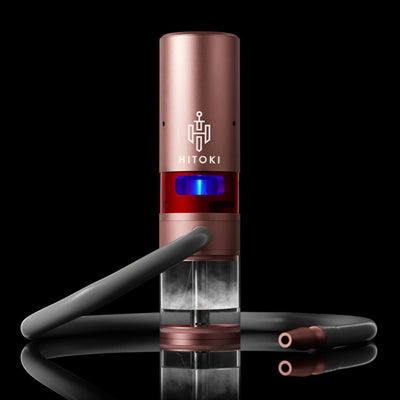 Rose gold Trident laser bong by Hitoki with concentrated beam technology