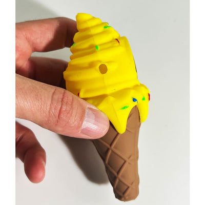 Bright yellow ice cream cone silicone pipe toy with waffle base and sprinkles
