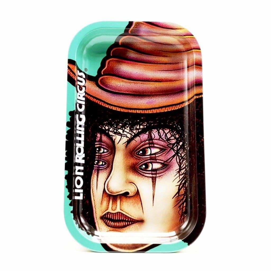 Surreal face with multiple eyes in chocolate ice cream on Lion Rolling Circus metal tray