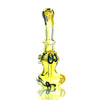Yellow glass bong with black swirls from the Mini Silver Fume Ring Bubbler Set