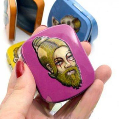 Vibrant pink mini tin box with bearded antique figure design