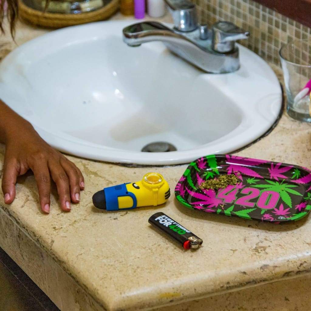 Minion silicone pipe - Fun hand pipe beside bathroom sink with drug paraphernalia