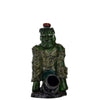 Green ceramic figurine with red hat by cannon, displayed in novelty wood pipe collection