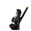 Hand-carved novelty wood pipe shaped like a person in a black suit with yellow accents