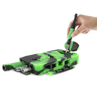 Green and black Ooze Slugger tool for a nice clean dab, manipulated by hand with a screwdriver