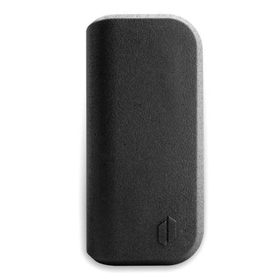 Textured gray rectangular device showcasing the Puffco Peak for potent concentrate flavor