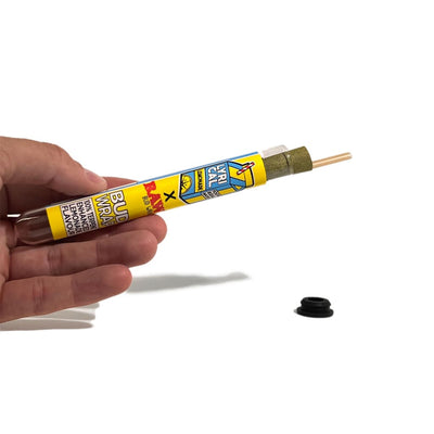 Hand Holding Yellow Tube Of ‘bud Wax’ Cannabis Concentrate By Lemonade Terpene Bud Wraps