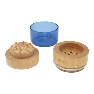 Raw natural wood grinder with impact-resistant glass and blue bowl