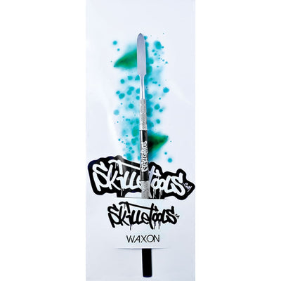 Metallic dabber tool with comfort grip for big wax slabs, surrounded by graffiti art