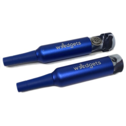 Two blue Wedgets divot tools beside retractable weed pipe with waterless cooling system