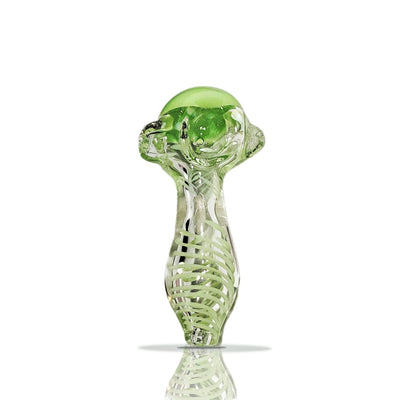 Green mushroom-shaped handmade glass pipe with intricate skeletal design and color-changing feature