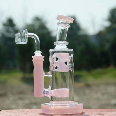 Glass water pipe with pink accents and a 14mm male quartz banger percolator design