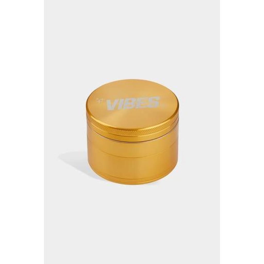 Gold-colored Vibes x Aerospaced 4-piece Grinder with anodized finish and ’VIBES’ engraving