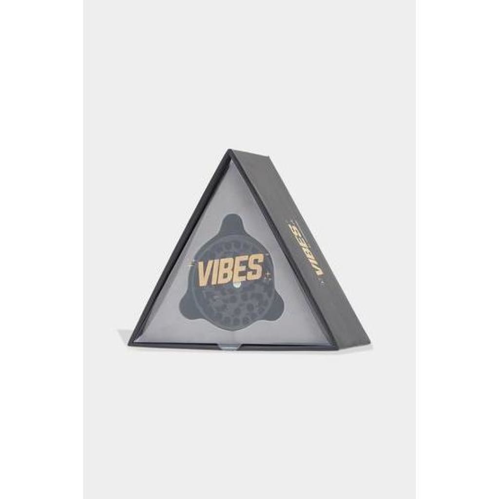 Triangular packaging of Vibes x Aerospaced 4-piece Grinder with anodized finish