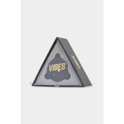 Triangular packaging of Vibes x Aerospaced 4-piece Grinder with anodized finish