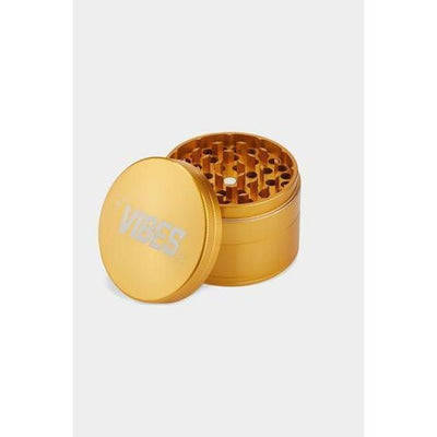 Gold-colored Vibes x Aerospaced 4-piece grinder with anodized finish and ’1235’ engraving